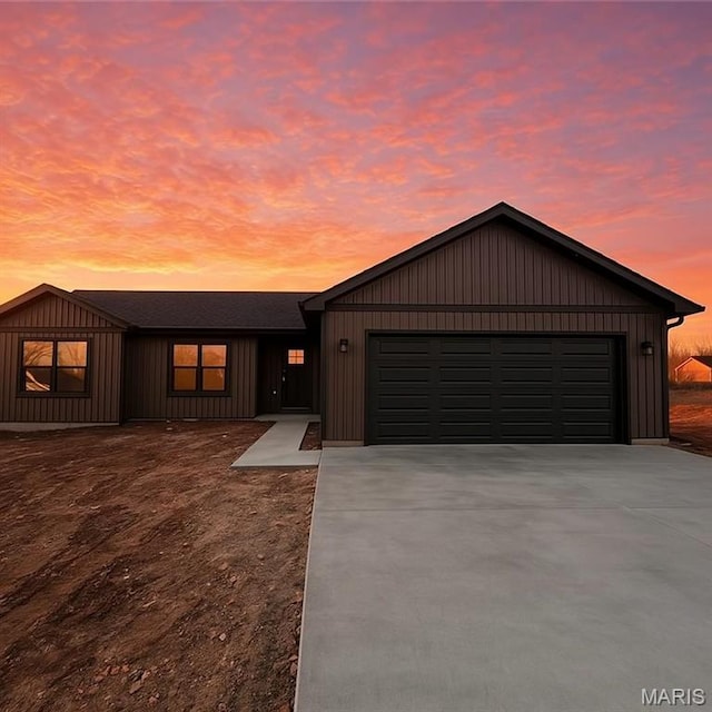 view of front of home with driveway and an attached garage
