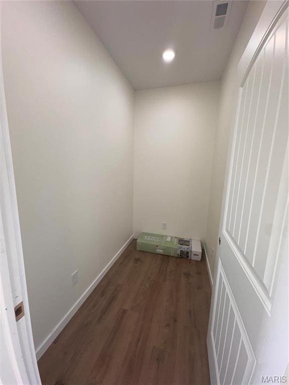 washroom with wood finished floors, baseboards, and recessed lighting