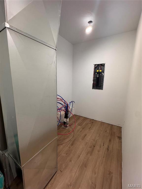 laundry area featuring wood finished floors