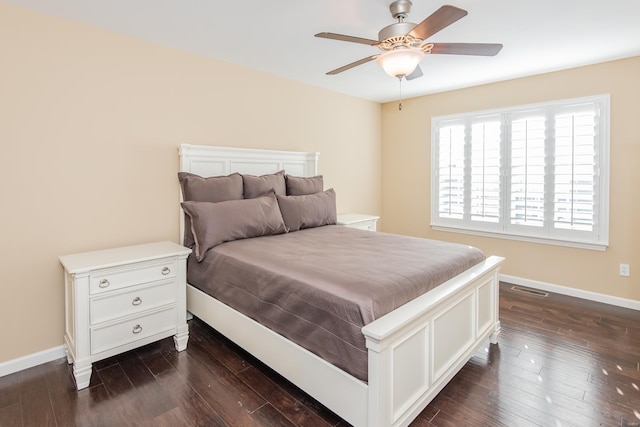 bedroom with dark wood finished floors, baseboards, and ceiling fan