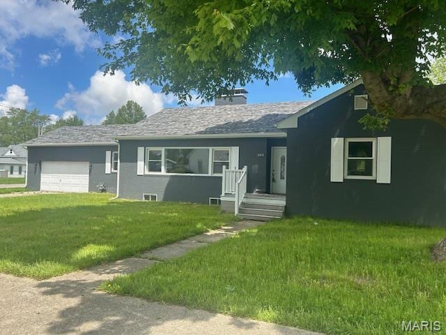 305 E Hauser St, Litchfield, IL 62056 - ranch-style house featuring an attached garage, a front lawn, and a chimney