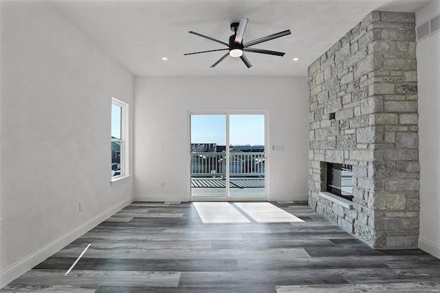 unfurnished living room featuring a fireplace, ceiling fan, wood finished floors, baseboards, and recessed lighting