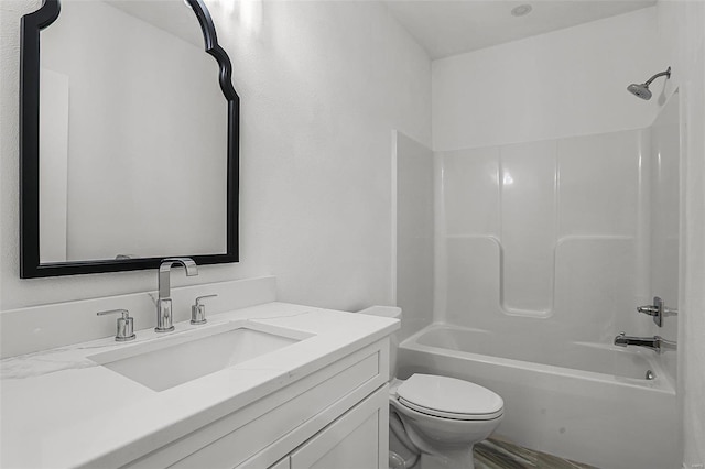 full bathroom featuring toilet, tub / shower combination, and vanity