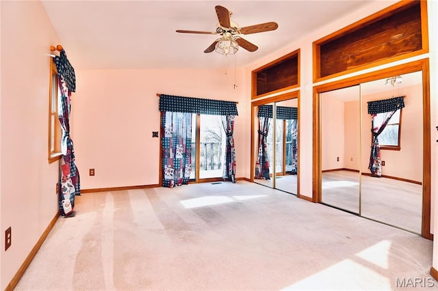 26 Gap Rd, Tunas, MO 65764 - unfurnished bedroom featuring multiple closets, carpet, baseboards, vaulted ceiling, and ceiling fan