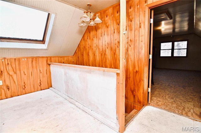 26 Gap Rd, Tunas, MO 65764 - bonus room featuring lofted ceiling, wood walls, and a chandelier