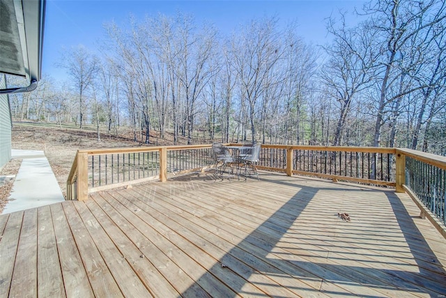 wooden deck featuring outdoor dining area