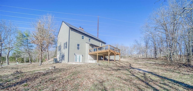 rear view of property with a deck