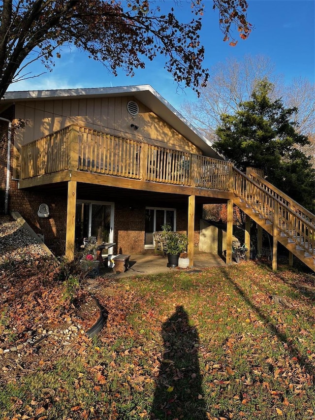 694 E 2735th Ave, Ramsey, IL 62080 - rear view of property with a wooden deck, stairway, and brick siding