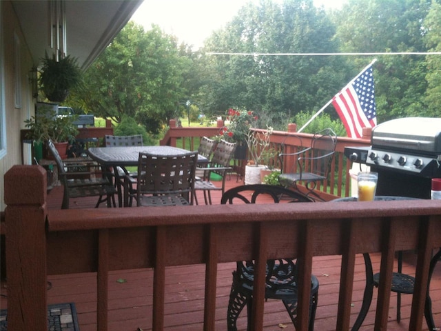 694 E 2735th Ave, Ramsey, IL 62080 - wooden terrace with outdoor dining area