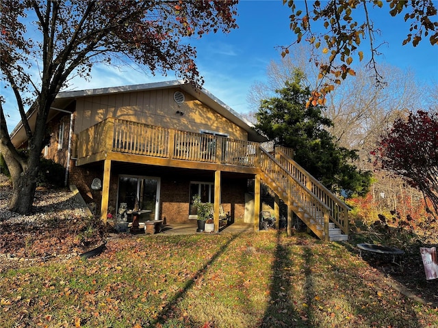 694 E 2735th Ave, Ramsey, IL 62080 - rear view of property with a deck, stairs, and a lawn