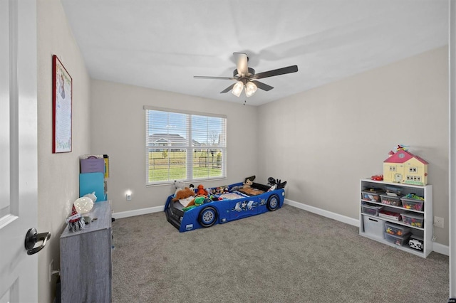 unfurnished bedroom with carpet, baseboards, and ceiling fan