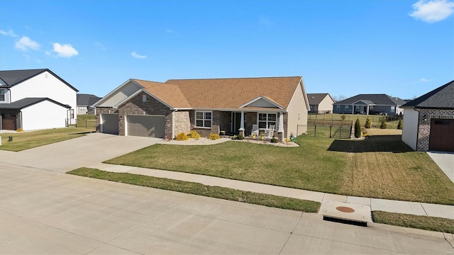 view of front of house featuring driveway, brick siding, an attached garage, and a residential view