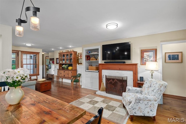 729 W Lockwood Ave, Saint Louis, MO 63122 - living room featuring wood finished floors and a brick fireplace