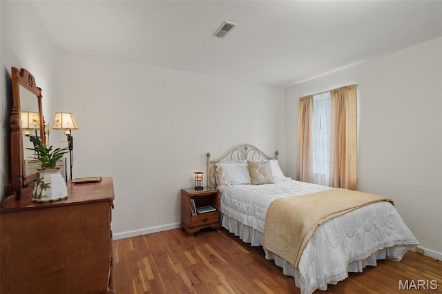 729 W Lockwood Ave, Saint Louis, MO 63122 - bedroom with wood finished floors and baseboards