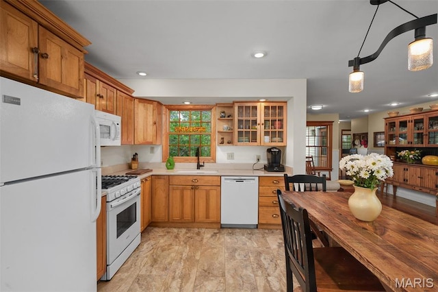 729 W Lockwood Ave, Saint Louis, MO 63122 - kitchen with white appliances, plenty of natural light, open shelves, glass insert cabinets, and recessed lighting
