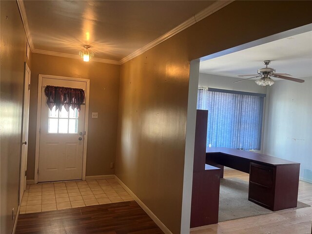 entryway featuring light wood-type flooring, a ceiling fan, crown molding, and baseboards