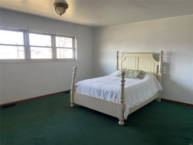 bedroom with carpet and baseboards