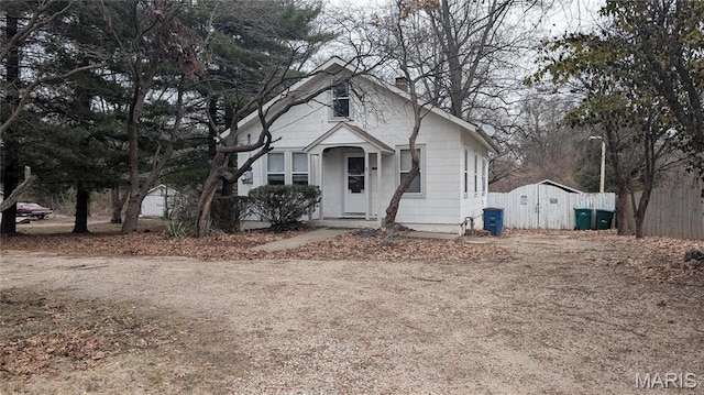 12532 Bellefontaine Rd, Saint Louis, MO 63138 - bungalow-style home with a chimney and fence
