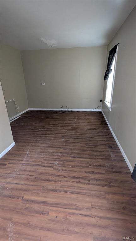 12532 Bellefontaine Rd, Saint Louis, MO 63138 - empty room featuring wood finished floors and baseboards