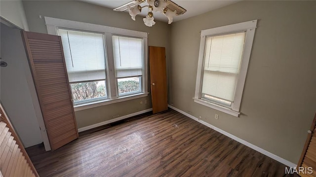12532 Bellefontaine Rd, Saint Louis, MO 63138 - unfurnished bedroom with wood finished floors, baseboards, and radiator heating unit