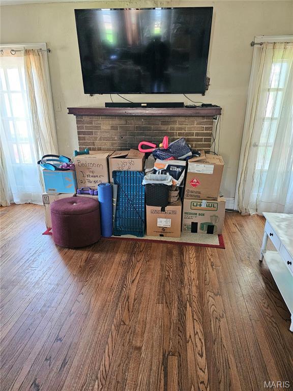 104 Emerling Dr, Saint Louis, MO 63121 - living room featuring wood finished floors and healthy amount of natural light