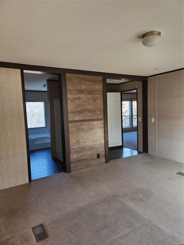 15005 Carthage Rd, Dixon, MO 65459 - empty room with carpet floors and a textured ceiling