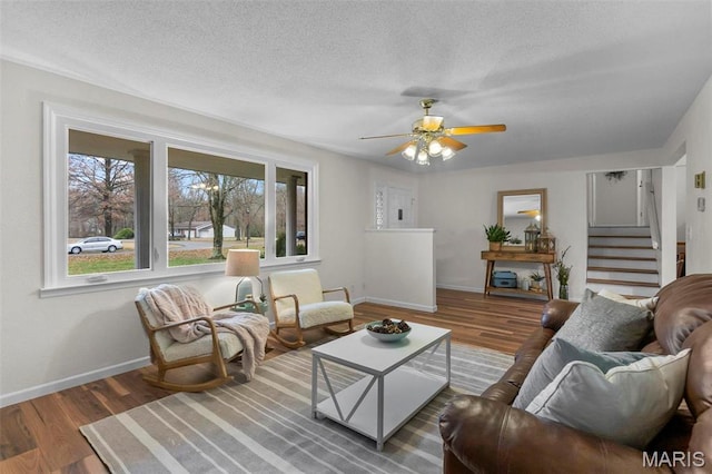 70 Garnet Ln, Cape Girardeau, MO 63701 - living room with wood finished floors, baseboards, stairs, ceiling fan, and a textured ceiling
