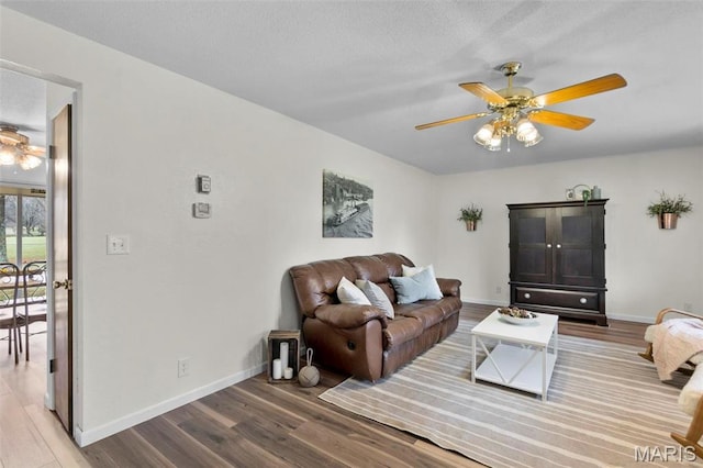 70 Garnet Ln, Cape Girardeau, MO 63701 - living area with wood finished floors, a ceiling fan, and baseboards