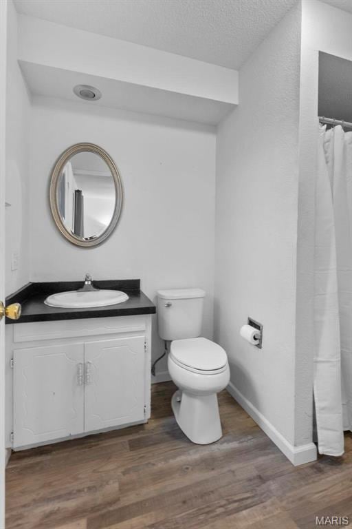 70 Garnet Ln, Cape Girardeau, MO 63701 - bathroom with vanity, wood finished floors, and curtained shower