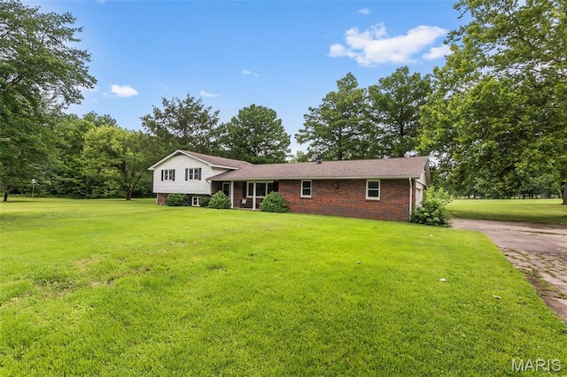 70 Garnet Ln, Cape Girardeau, MO 63701 - split level home with a front lawn, brick siding, and concrete driveway