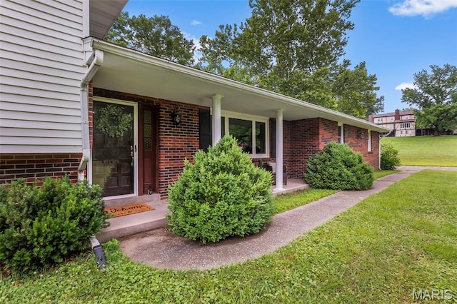 70 Garnet Ln, Cape Girardeau, MO 63701 - entrance to property featuring a yard, brick siding, and a porch