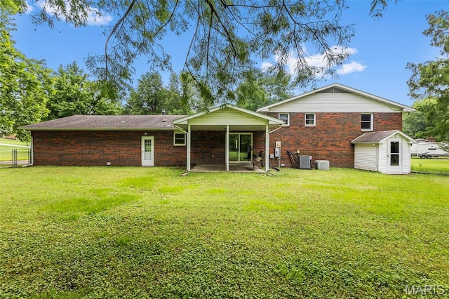 70 Garnet Ln, Cape Girardeau, MO 63701 - back of house featuring brick siding and a patio