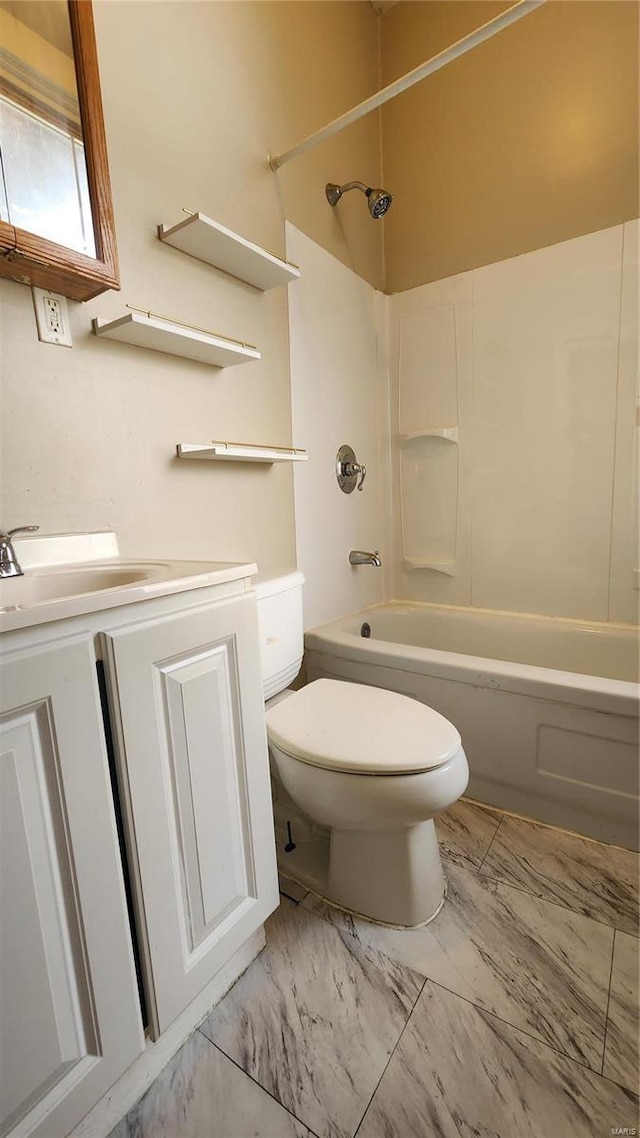 1412 Benton St, Saint Louis, MO 63106 - bathroom featuring toilet, vanity, bathing tub / shower combination, and marble finish flooring