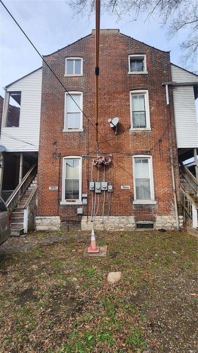 1412 Benton St, Saint Louis, MO 63106 - rear view of house with brick siding and stairs