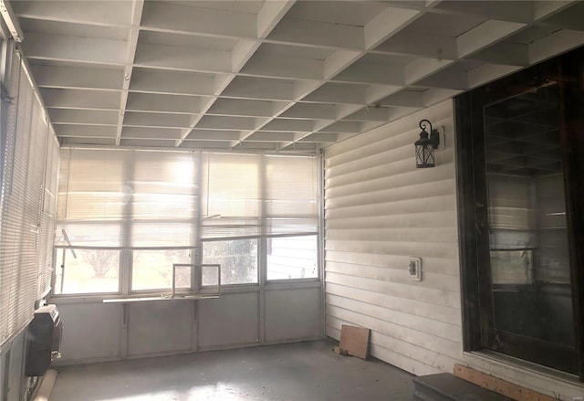 unfurnished sunroom with plenty of natural light