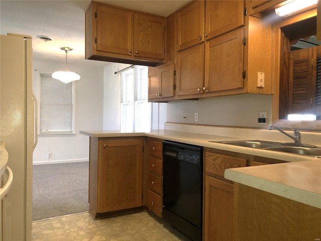 kitchen featuring dishwasher, freestanding refrigerator, brown cabinets, a peninsula, and light countertops