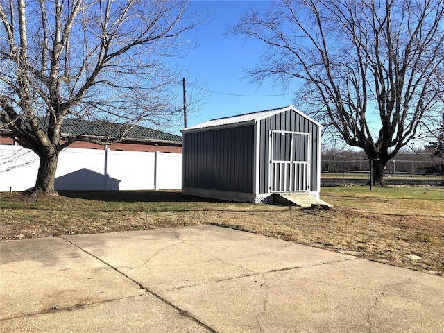 view of shed with fence