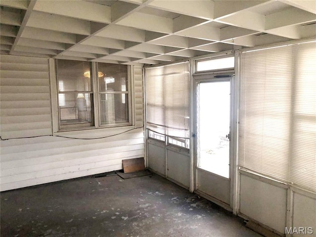 1210 N Prairie, Bloomfield, MO 63825 - spare room with concrete flooring and coffered ceiling