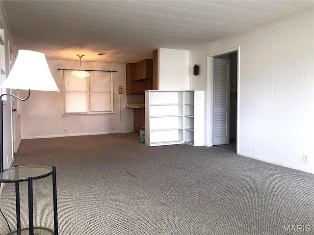 1210 N Prairie, Bloomfield, MO 63825 - unfurnished living room featuring carpet flooring and baseboards