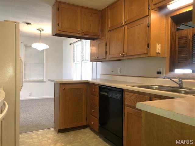 1210 N Prairie, Bloomfield, MO 63825 - kitchen featuring black dishwasher, freestanding refrigerator, a peninsula, brown cabinetry, and a sink