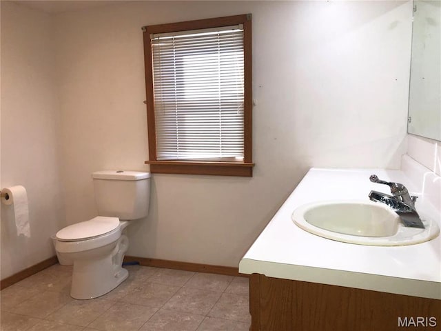 1210 N Prairie, Bloomfield, MO 63825 - bathroom featuring baseboards, vanity, toilet, and tile patterned flooring