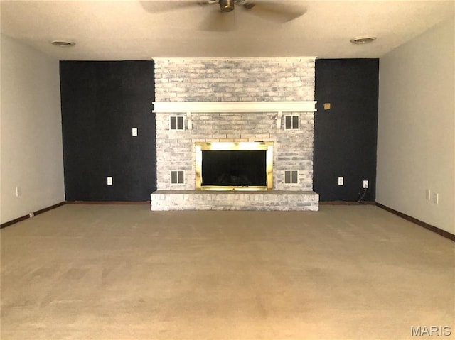 1210 N Prairie, Bloomfield, MO 63825 - unfurnished living room with a ceiling fan, carpet flooring, a brick fireplace, and baseboards