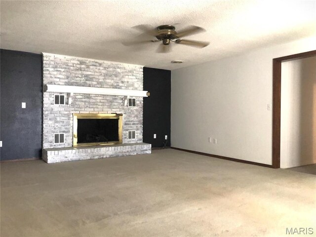 1210 N Prairie, Bloomfield, MO 63825 - unfurnished living room with a ceiling fan, carpet floors, a fireplace, and a textured ceiling