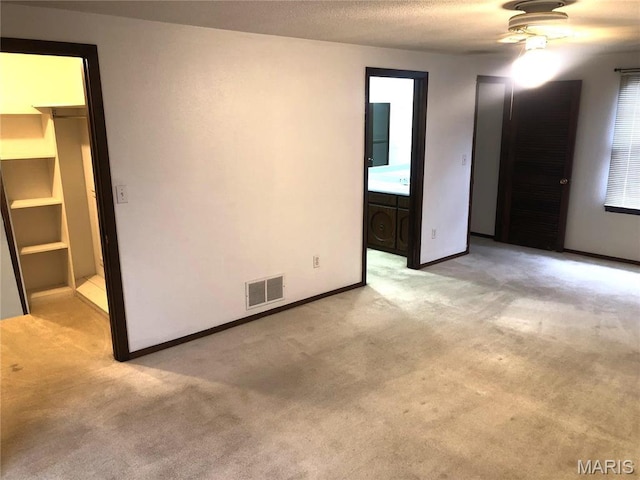 1210 N Prairie, Bloomfield, MO 63825 - unfurnished bedroom featuring light colored carpet and baseboards