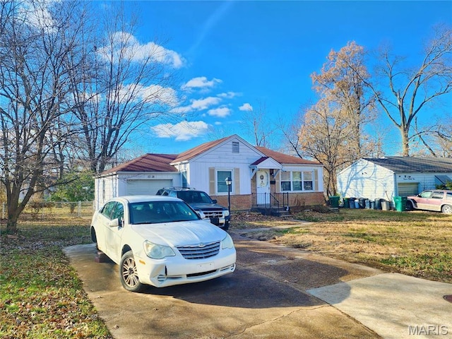 1238 Hoyt Dr, Saint Louis, MO 63137 - view of front facade featuring driveway