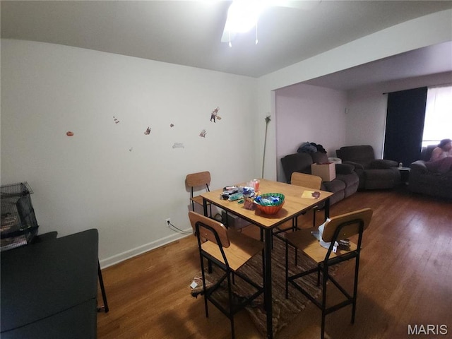 9409 Aetna Dr, Saint Louis, MO 63137 - dining area featuring wood finished floors, ceiling fan, and baseboards
