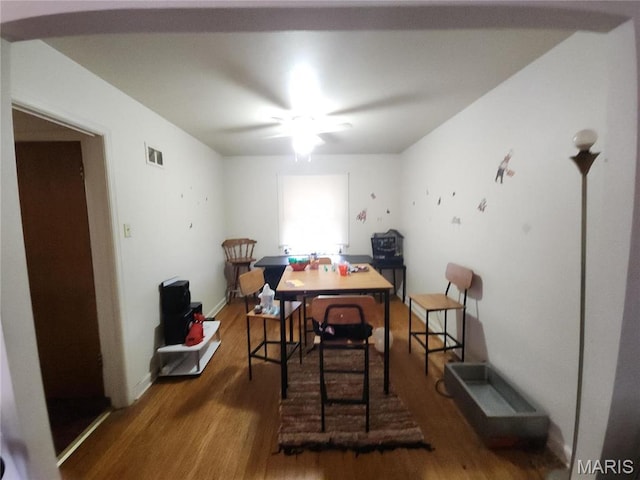9409 Aetna Dr, Saint Louis, MO 63137 - dining area featuring wood finished floors, a ceiling fan, and baseboards