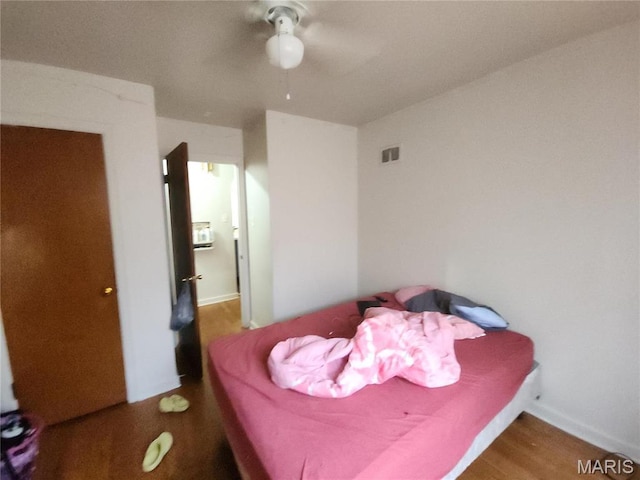 9409 Aetna Dr, Saint Louis, MO 63137 - bedroom featuring wood finished floors and a ceiling fan