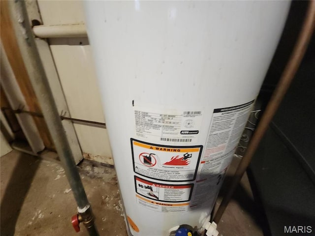 9409 Aetna Dr, Saint Louis, MO 63137 - detailed view of water heater and concrete floors