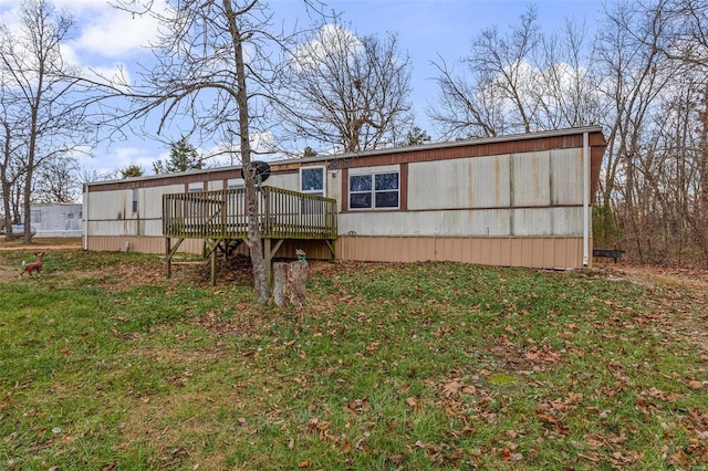 rear view of house featuring a deck